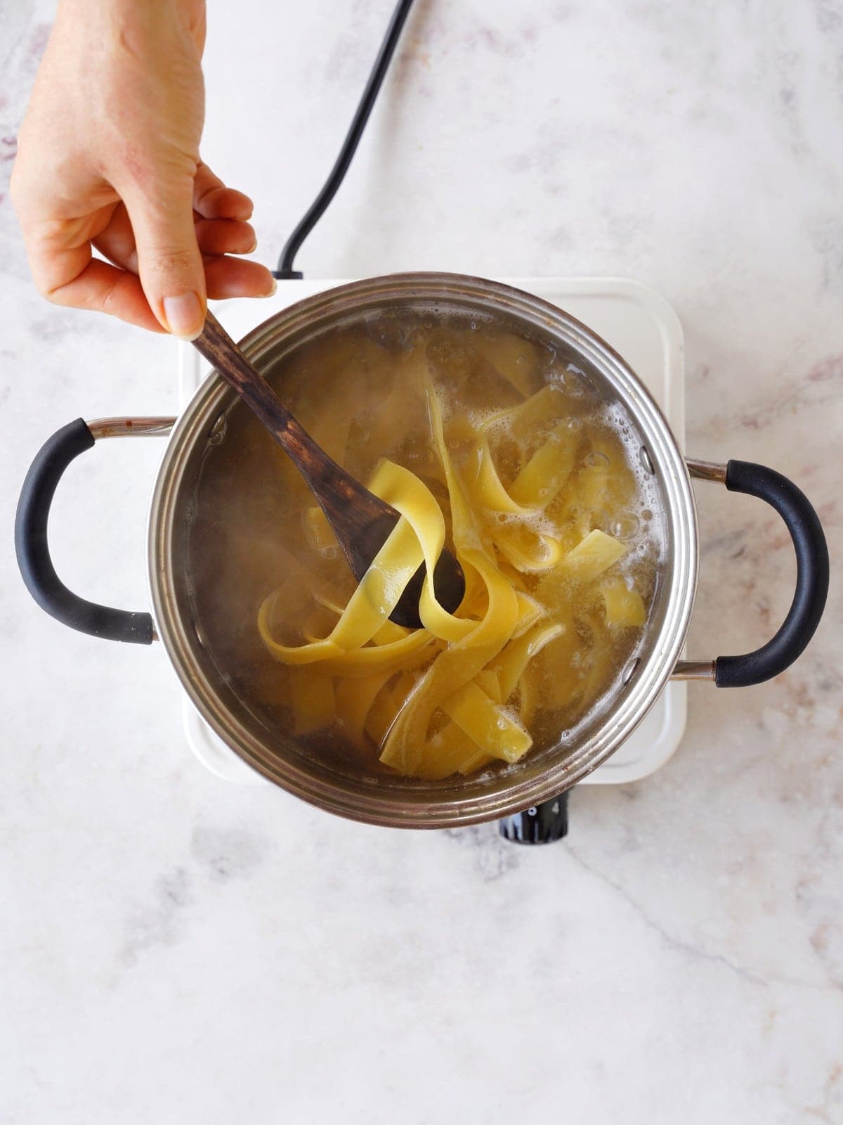 pappardelle cooking in pot