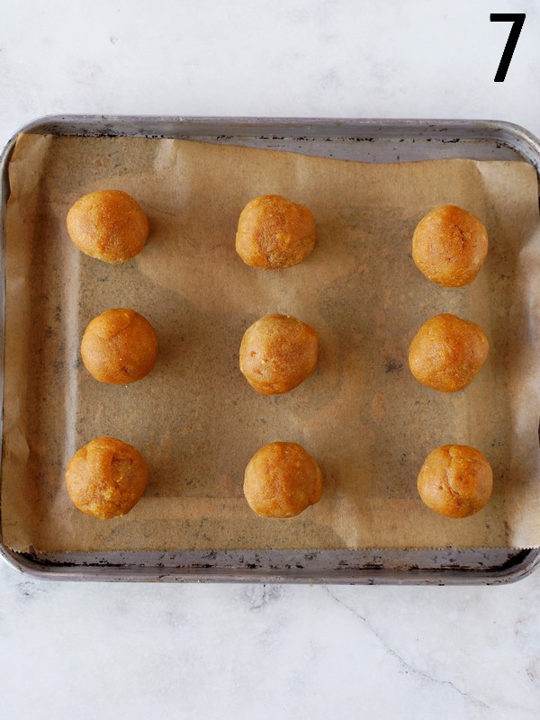 9 cookie dough balls on baking sheet