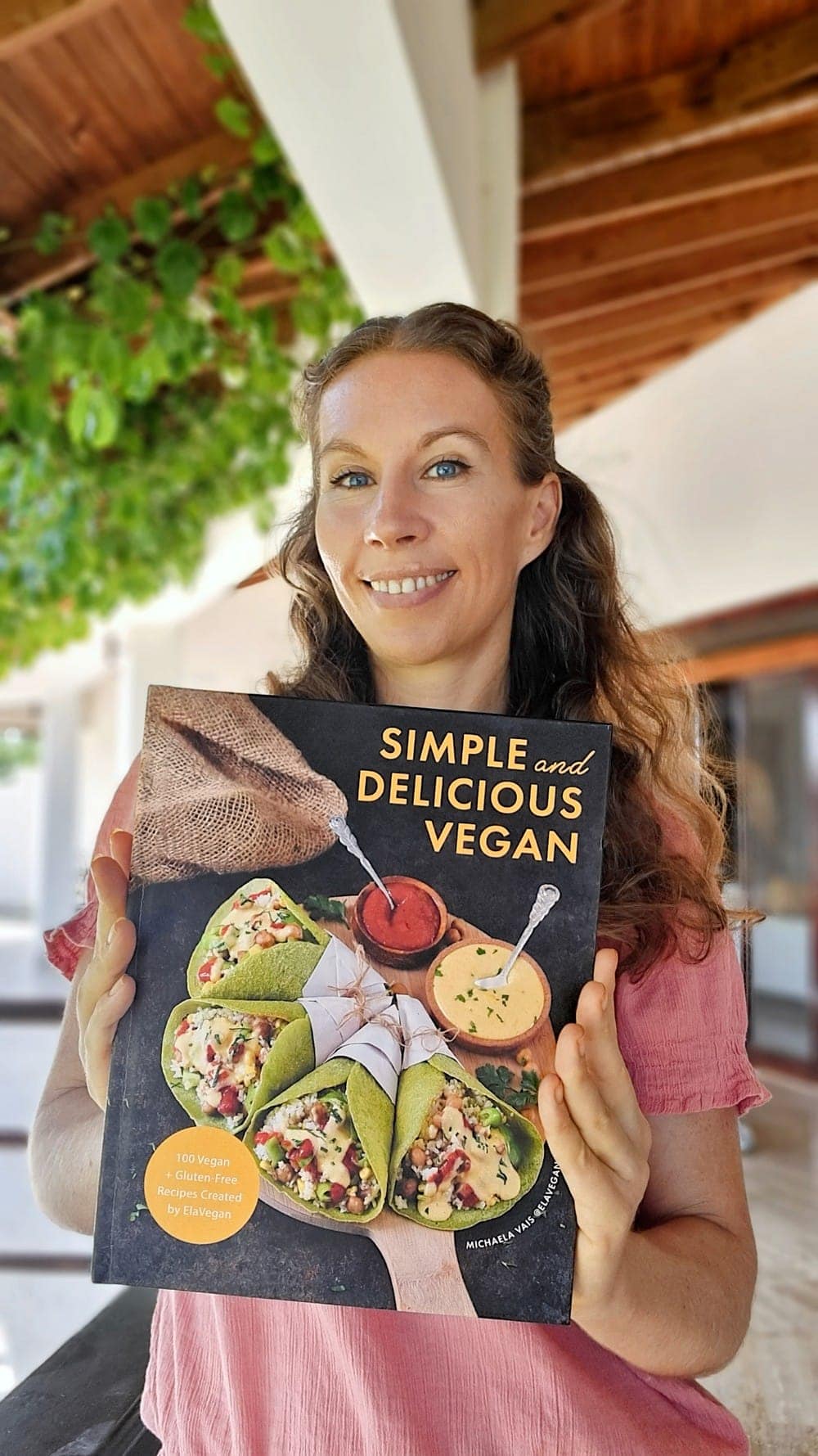 Michaela Vais with her cookbook Simple and Delicious Vegan