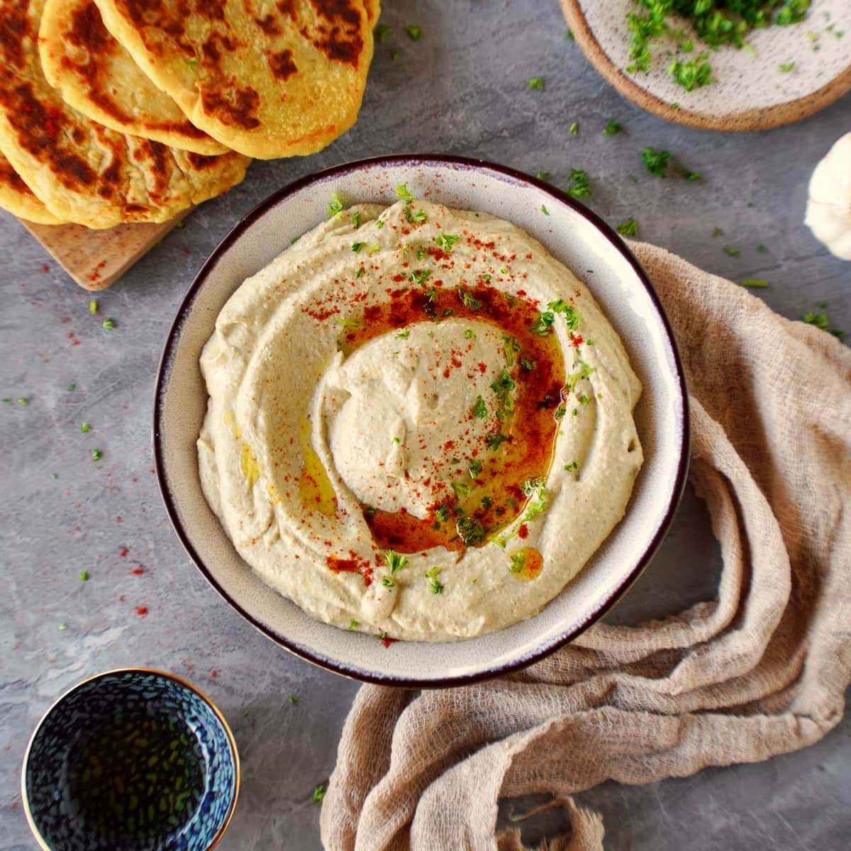 Dip from lentils in bowl with flatbread