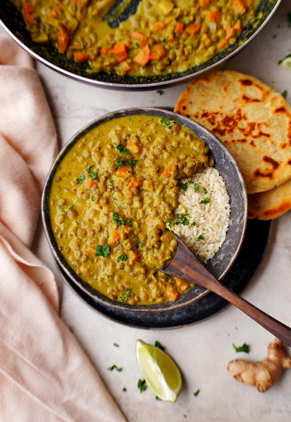 top shot of lentil dal in bowl with spoon