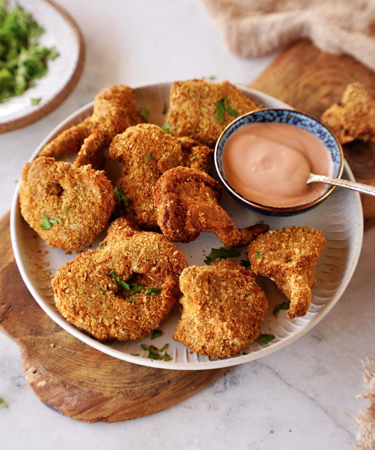 vegan chicken nuggets on a plate with dip