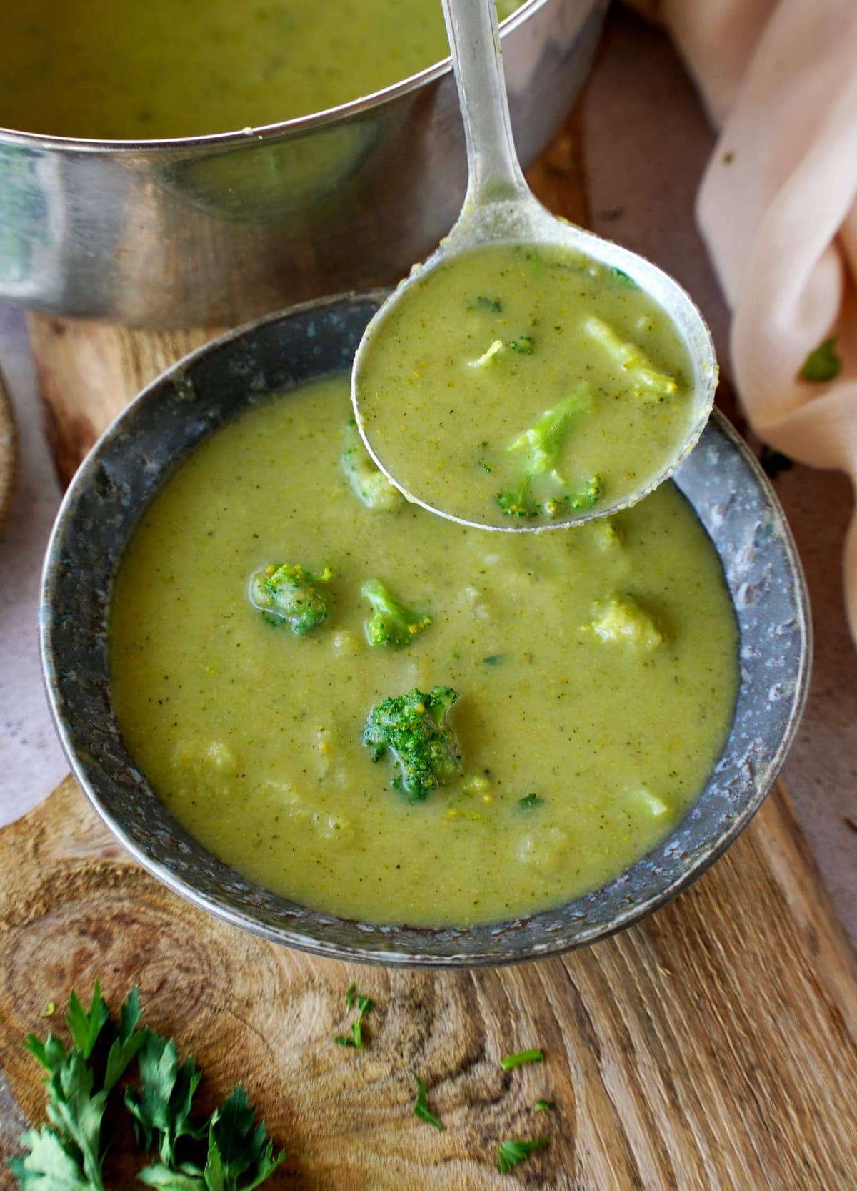 broccoli chowder in bowl with ladle