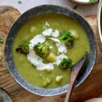 healthy vegan broccoli soup in bowl with spoon