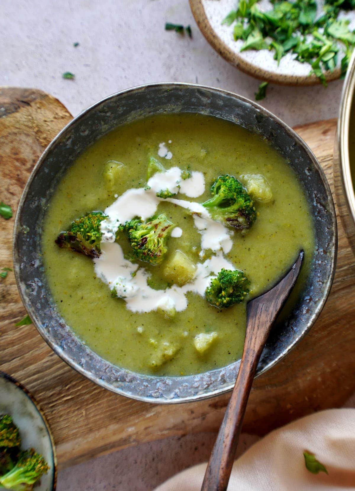 healthy vegan broccoli soup in bowl with spoon