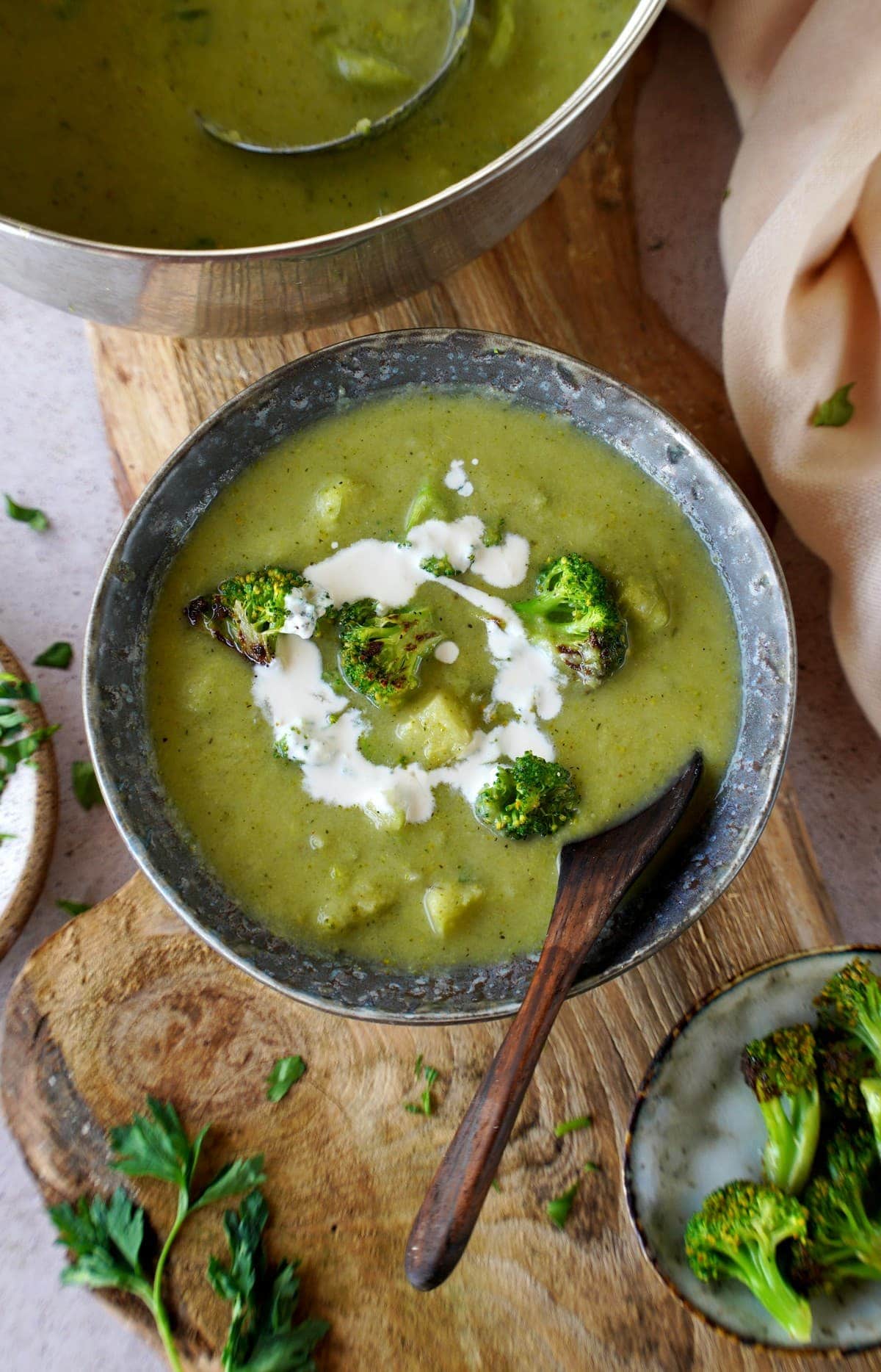 top shot of vegan broccoli soup in bowl with spoon