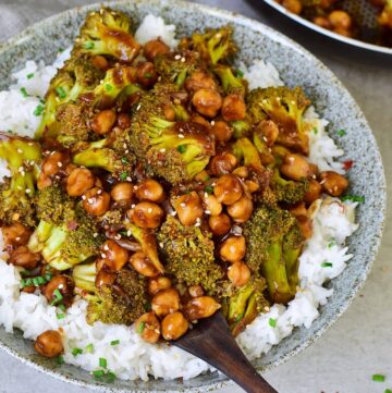 Garlic Broccoli stir fry with chickpeas over rice in bowl