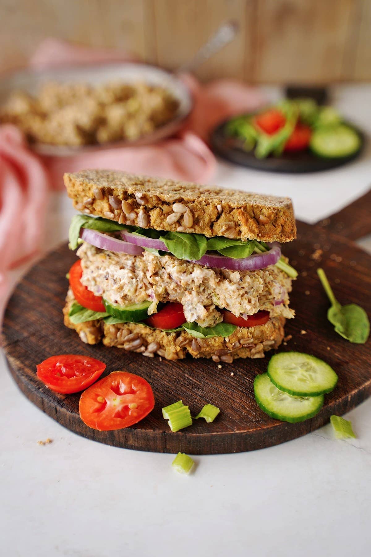 vegan chickpea tuna salad sandwich on wooden board