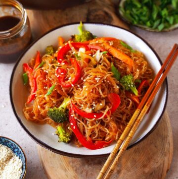 Asian vermicelli stir-fry with chopsticks on plate