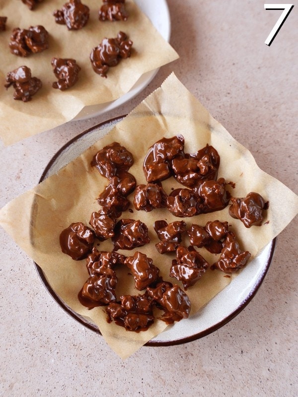 chocolate covered rice cake bites on parchment paper lined plate