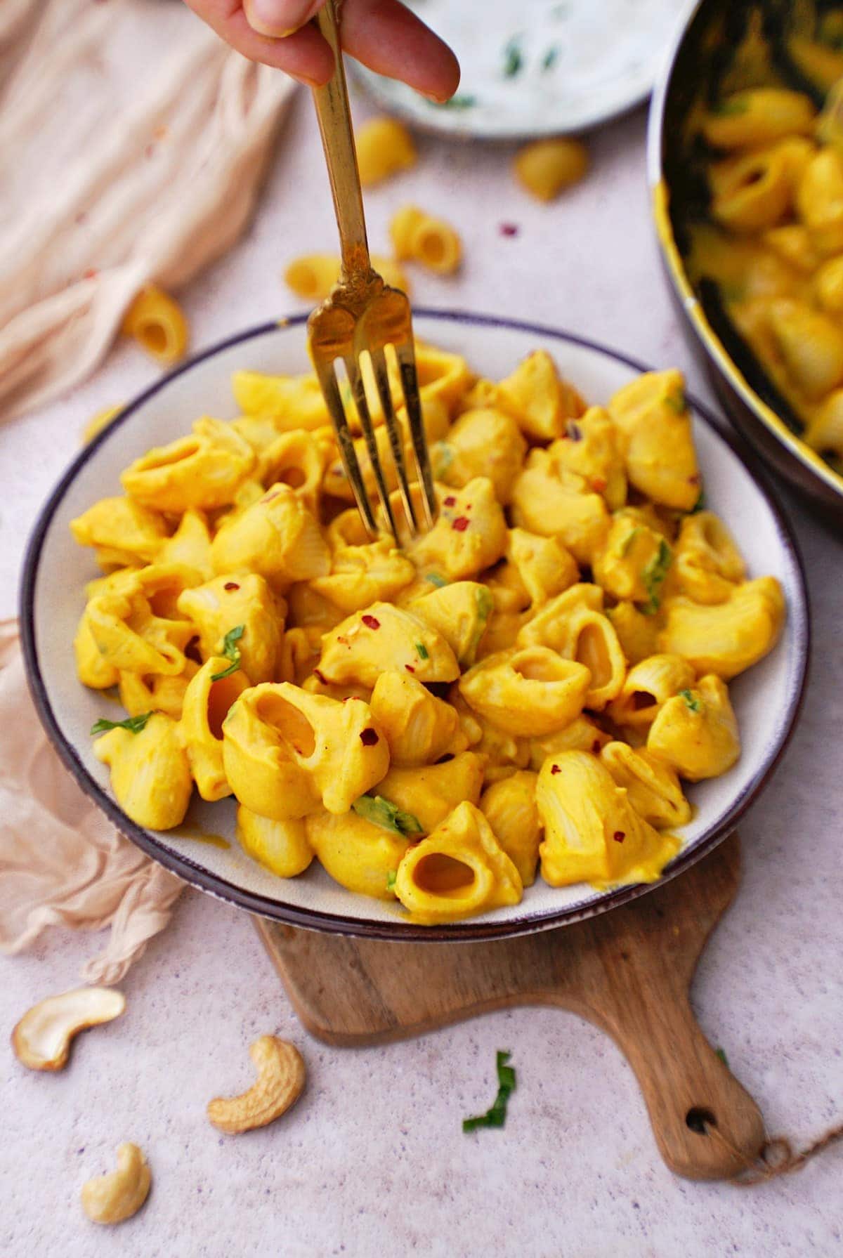 vegan butternut mac and cheese on plate with fork