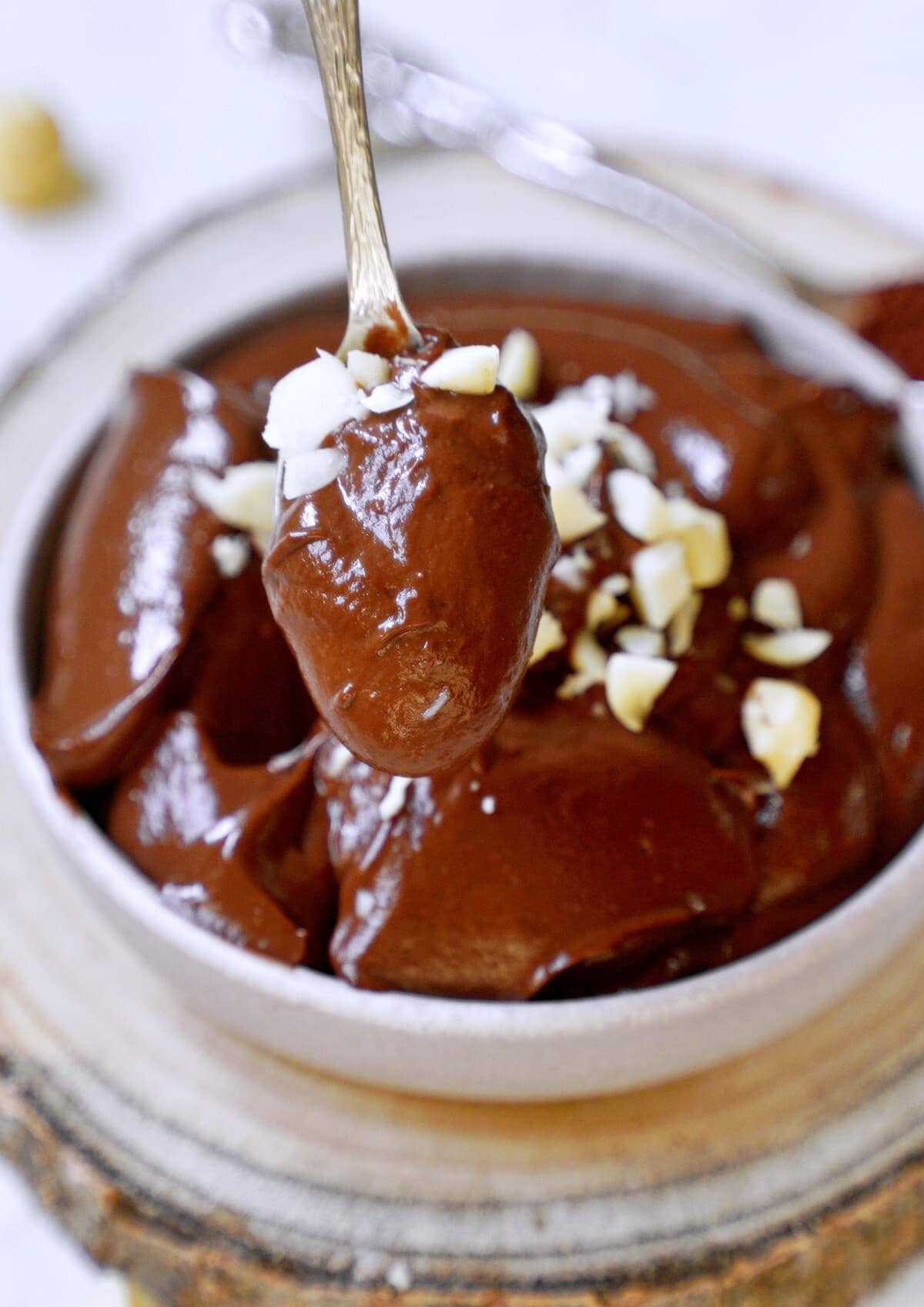 close-up dairy-free chocolate pudding with crushed nuts