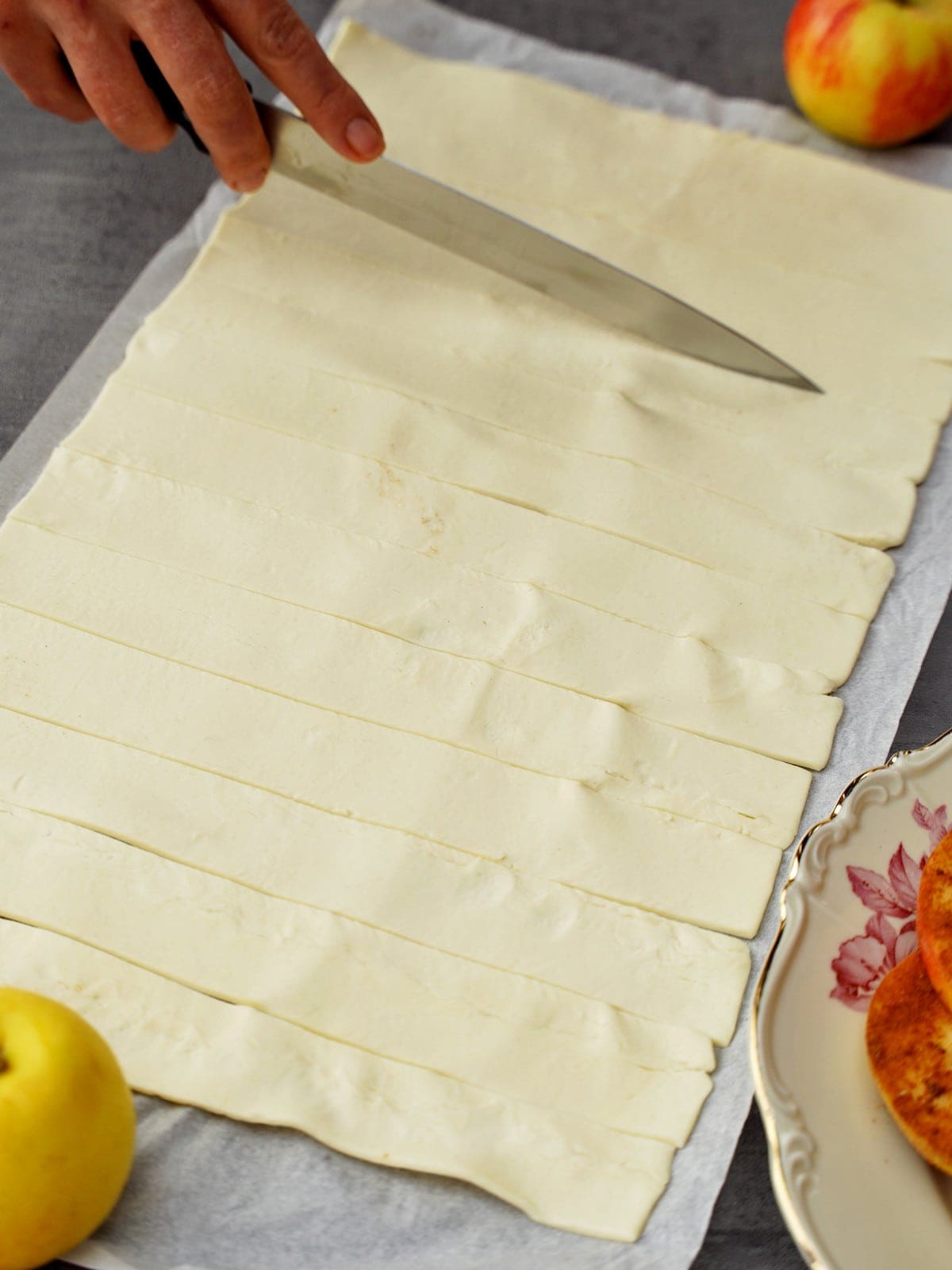 slicing puff pastry into strips