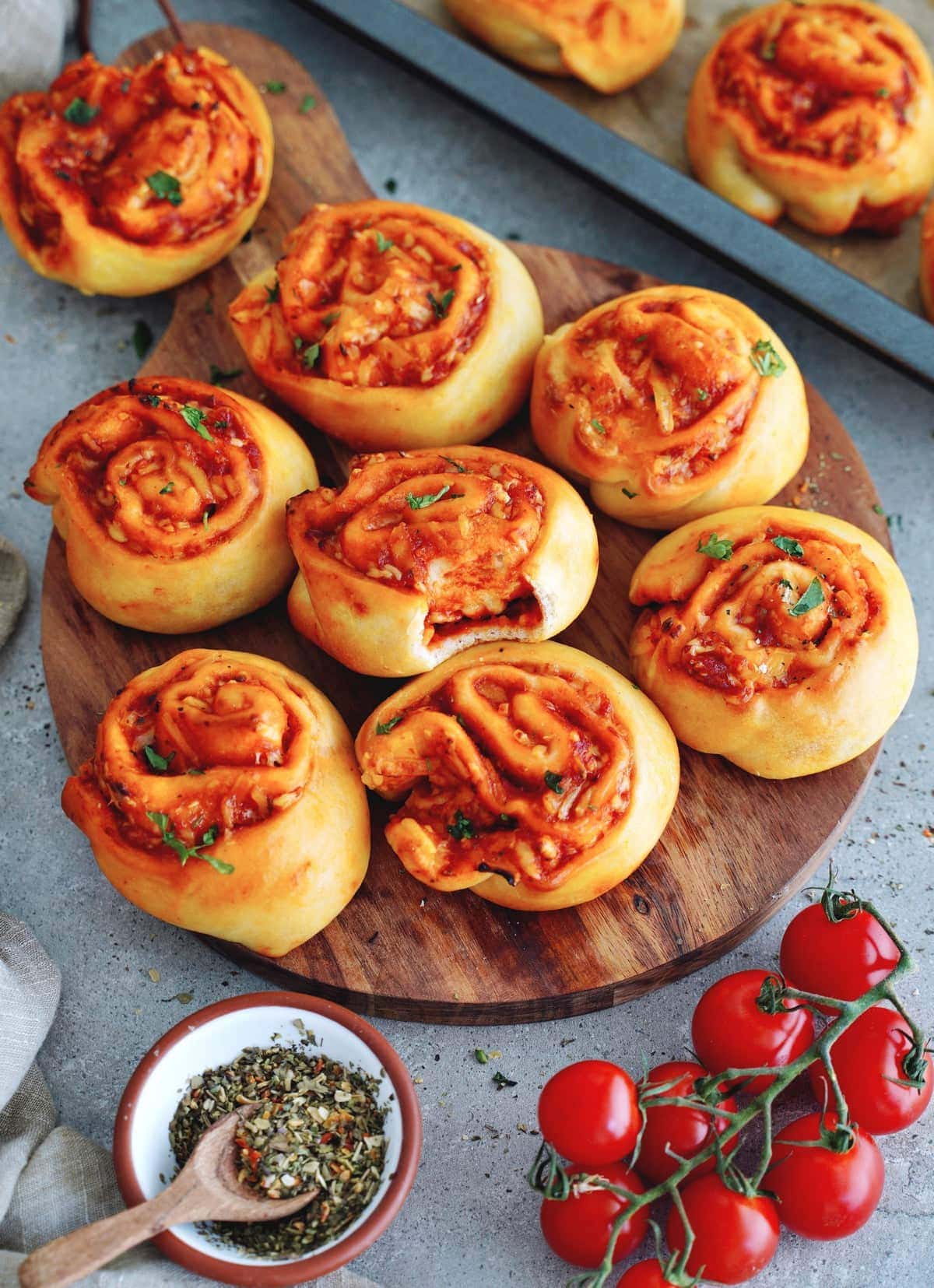 tomato pizza buns on wooden board