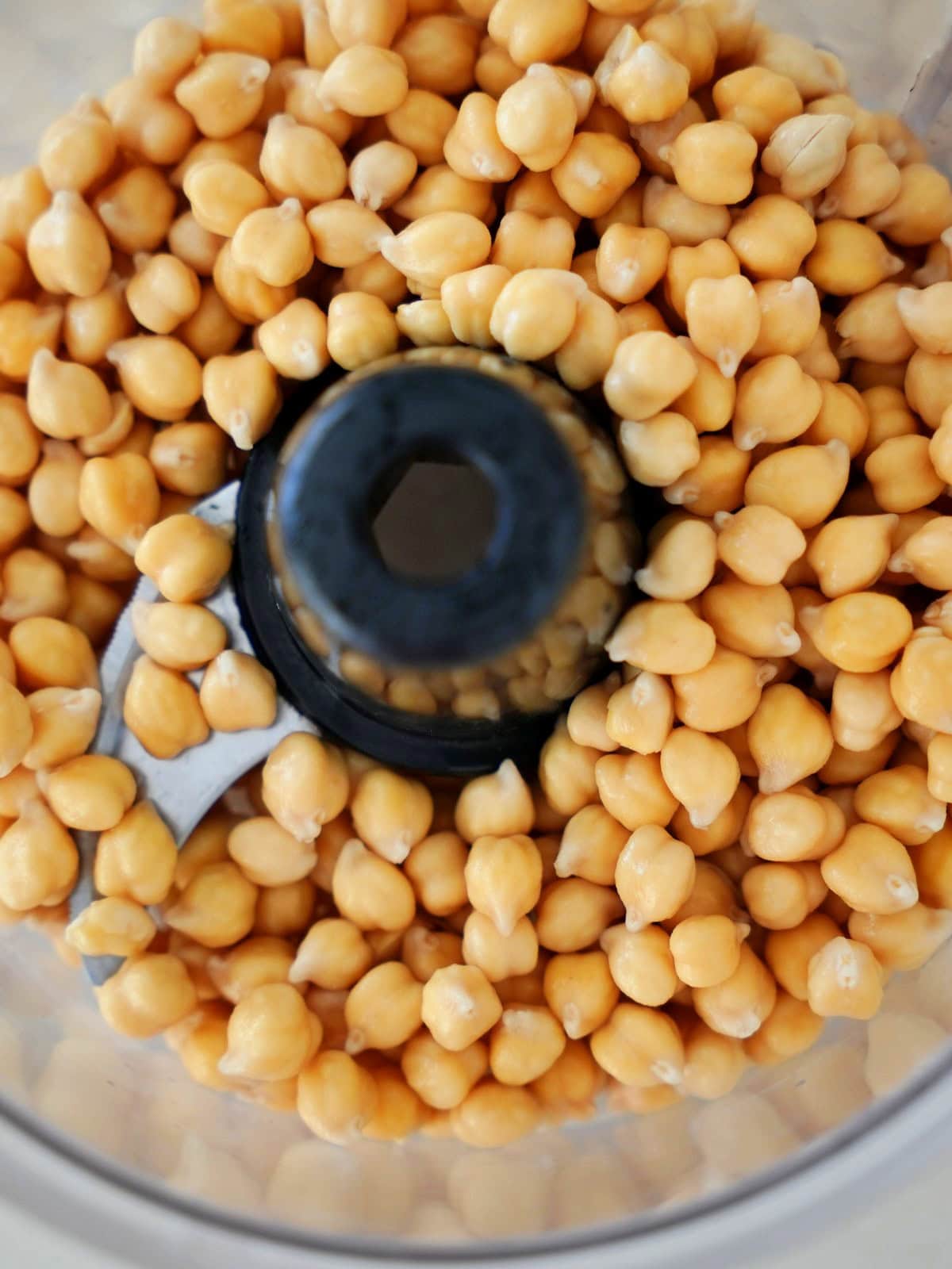 Close-up of chickpeas in a food processor