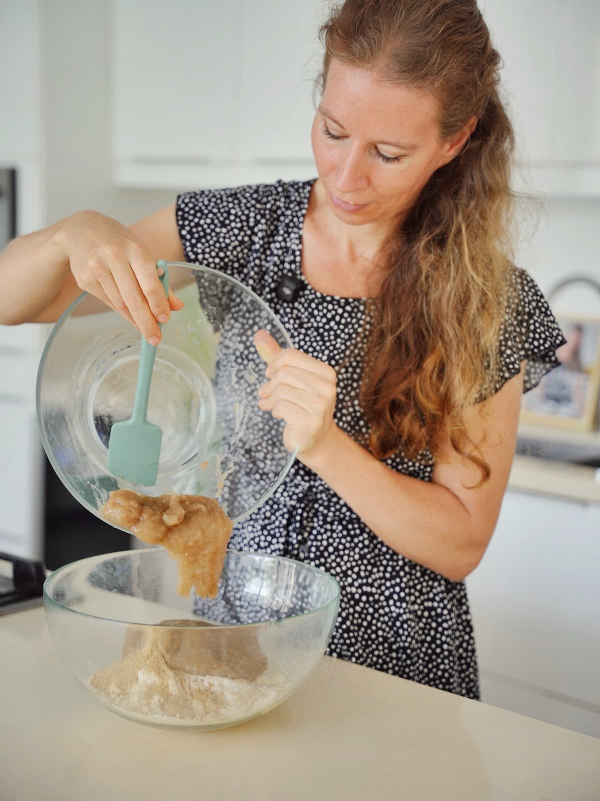 Michaela Vais pours psyllium gel from one glass bowl to another