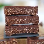 3 stacked chocolate quinoa bars with a crunchy texture