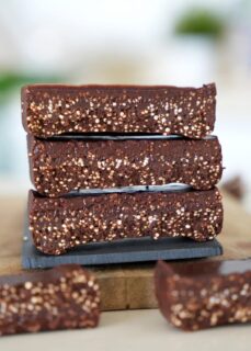 3 stacked chocolate quinoa bars with a crunchy texture