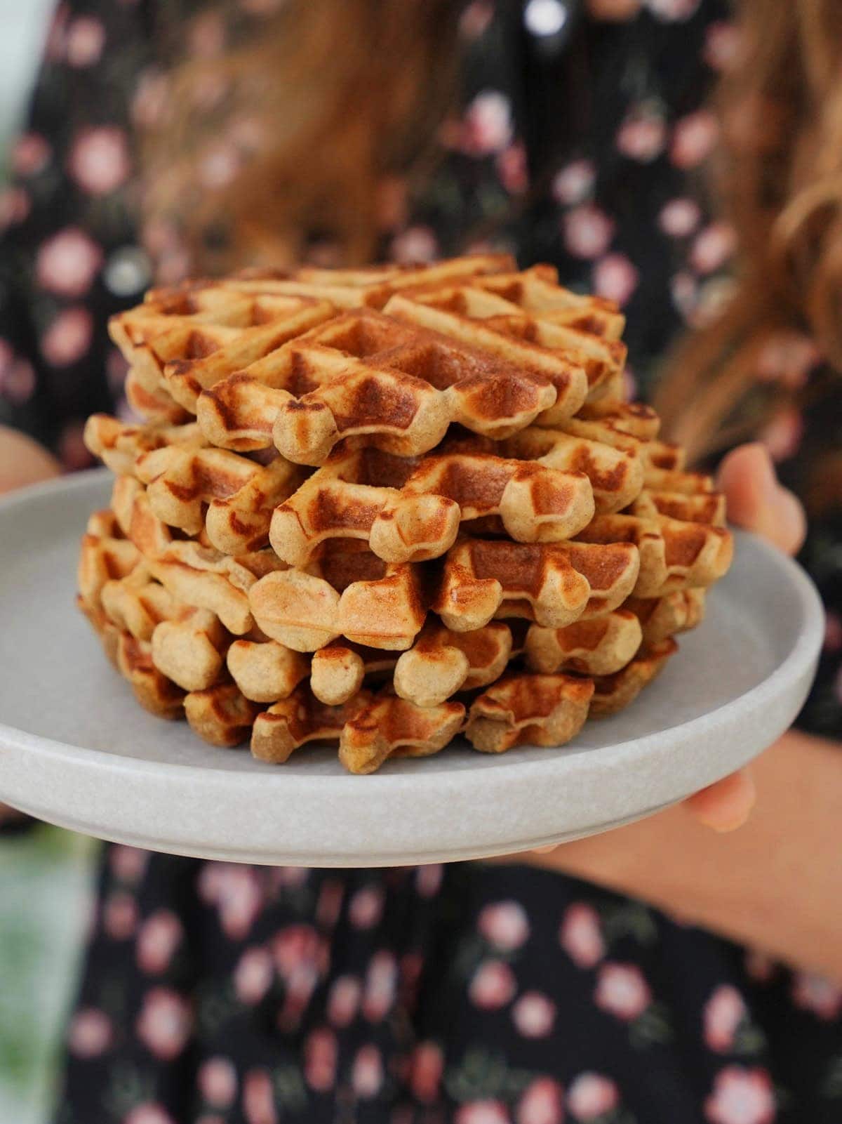 Stack of waffles on a light gray plate