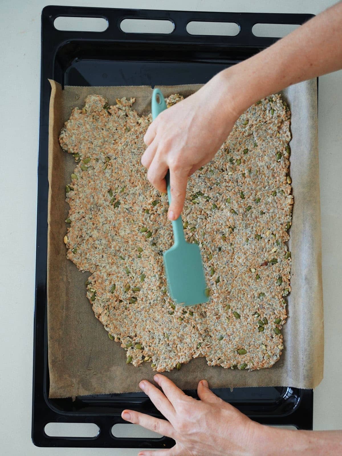 Spreading dough onto a baking sheet