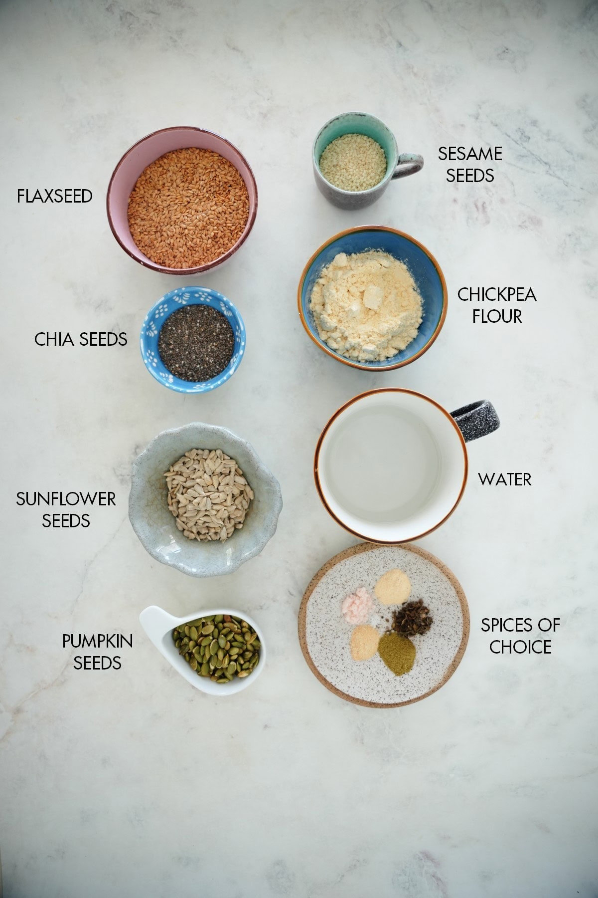 ingredients for seed crackers in small bowls