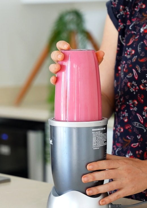 Blending beetroot pasta sauce in a blender