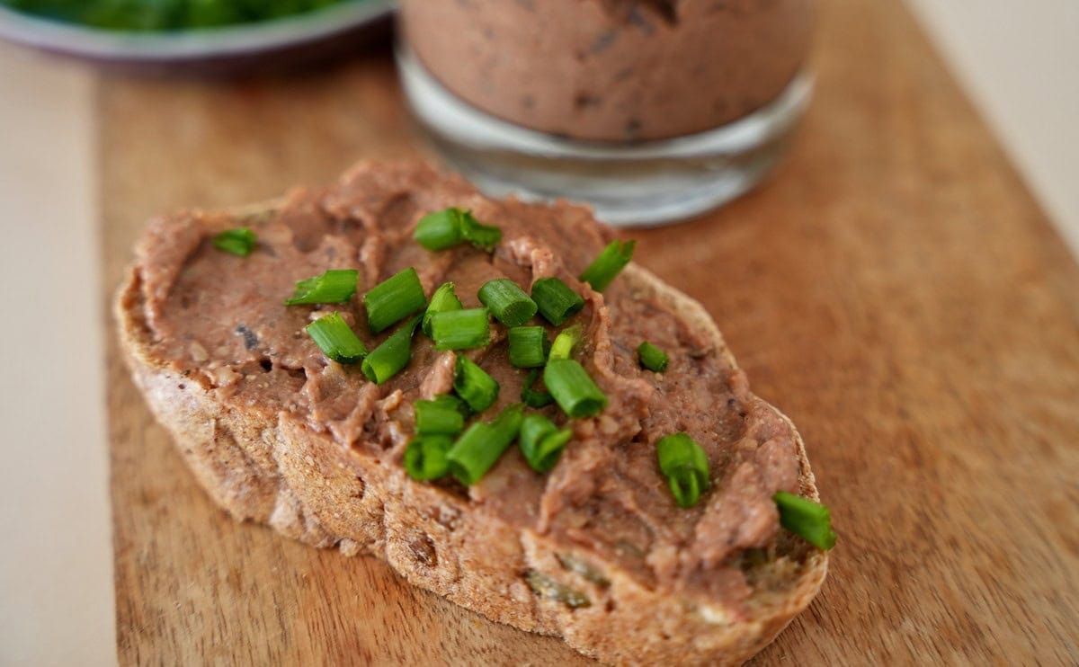 vegan liverwurst on a slice of bread with chives