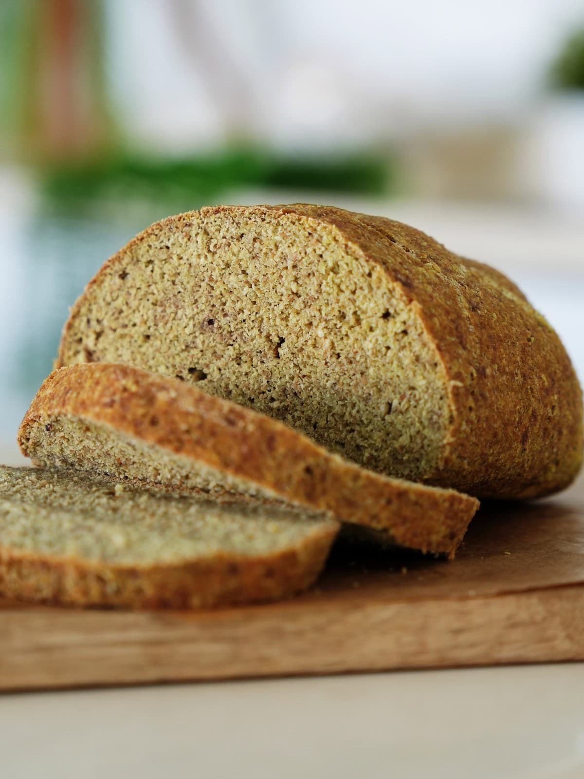 Sliced green pea bread on wooden board